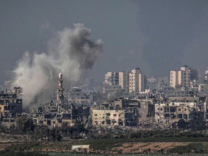 Explosion in a decimated Gaza Strip neighborhood; photo taken from Sderot, Israel; October 28, 2023.