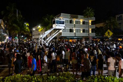 Crowds gather at Ocean Drive and 8th during spring break on Saturday, March 18, 2023, in Miami Beach, Fla.