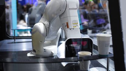 A robot serves a coffee at the 2019 Mobile World Congress in Barcelona.