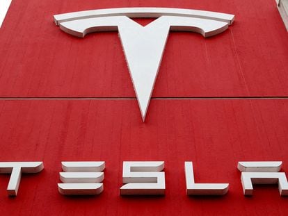 The logo of car manufacturer Tesla is seen at a branch office in Bern, Switzerland October 28, 2020.