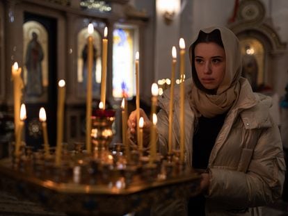 A parishioner inside the Church in honor of the Mother of God in Dnipro.