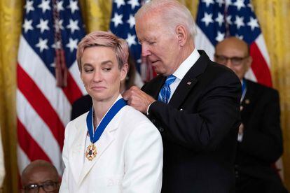 U.S. President Joe Biden gives Megan Rapinoe the Presidential Medal of Freedom.