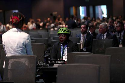 Costa at the table of Ivory Coast delegates at the climate summit.