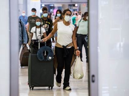 Passengers arriving in Madrid's Barajas Airport on Monday.