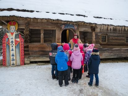 Children visit St. Nicholas' Hut in the Museum of Folk Architecture and Life in Lviv (Ukraine), on December 19, 2022.