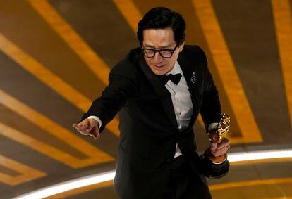 Ke Huy Quan accepts his award for best supporting actor.