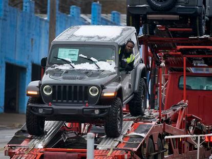 A new Jeep is delivered to a dealership in Pittsburgh on Monday, Jan. 23, 2023. On Friday, the Commerce Department issues its December report on consumer spending. (AP Photo/Gene J. Puskar)