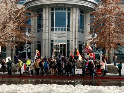 Dozens of tribe members and other protesters beating drums and waving signs rally in front of the federal courthouse in Reno, Nev. Thursday, Jan. 5, 2023.