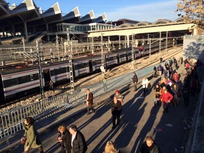 Passengers are evacuated outside Atocha station on Friday.