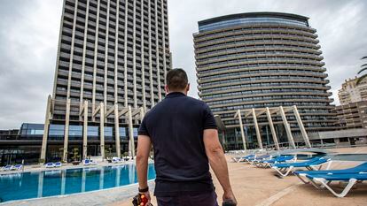 Benidorm's tourism sector is getting ready to reopen. Above, a maintenance worker at the Hotel Bali.