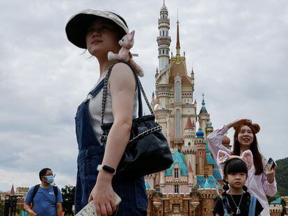 Visitors stands in front of the Castle of Magical Dreams at Hong Kong Disneyland, China October 13, 2023.