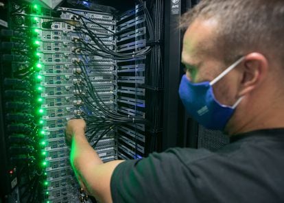 An employee at Interxion's MAD1 data center operates a server. 