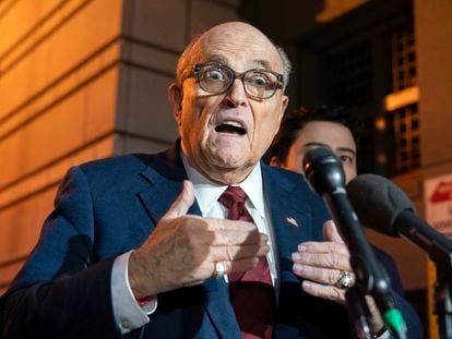 Former New York Mayor Rudy Giuliani talks to reporters as he leaves the federal courthouse in Washington, Dec. 11, 2023.