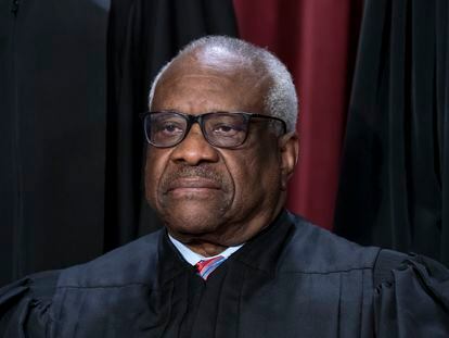 Associate Justice Clarence Thomas joins other members of the Supreme Court as they pose for a new group portrait, at the Supreme Court building in Washington, Oct. 7, 2022.