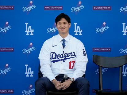 Los Angeles Dodgers' Shohei Ohtani answers questions during a news conference at Dodger Stadium, December 14, 2023.