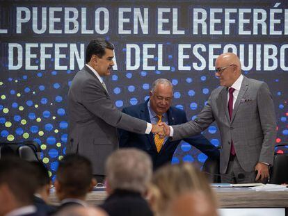 Venezuelan President Nicolás Maduro greets the president of the National Assembly, Jorge Rodriguez, at a National Electoral Council (CNE) ceremony on Monday, in Caracas.