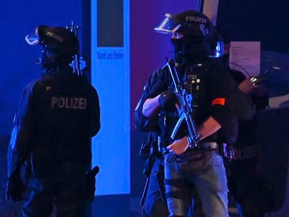 Armed police officers near the scene of a shooting in Hamburg, Germany on March 9, 2023, after one or more people opened fire in a church.