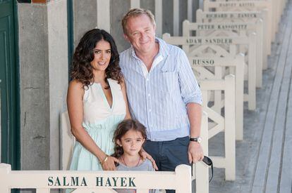 Salma Hayek and her husband Francois-Henri Pinault pose with their daughter Valentina on the French beach at Deauville in September 2012.