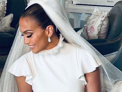 Jennifer Lopez, in a wedding dress designed by Ralph Lauren.