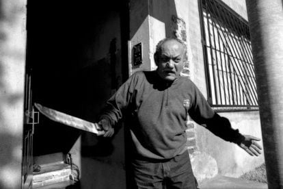 A man refuses to be evicted from his home in Buenos Aires in 2000.