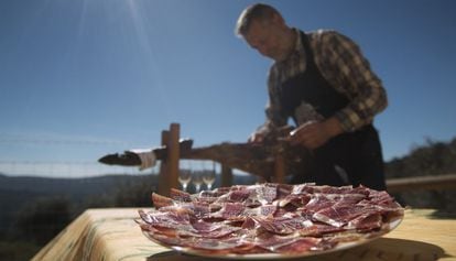 Eduardo Donato serves some of his prized ham.