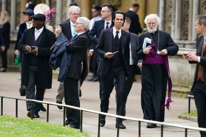 Nick Cave, center, arrives ahead of the coronation ceremony of King Charles III  at Westminster Abbey.