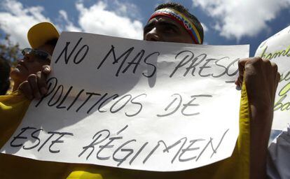 A demonstrator attends a protest in Caracas following the arrest of Caracas Mayor Antonio Ledezma.