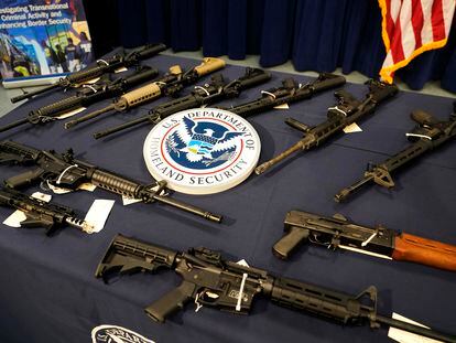 Firearms are displayed at the Miami Field Office of the Homeland Security Investigations, that was working with other agencies to crack down on an increase of firearms and ammunition smuggling to Haiti, in August 2022.