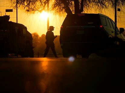 A guardsman checks a vehicle at the gate for Shelby Park, which troops from the Texas National Guard seized and began turning away federal immigration authorities, Thursday, Feb. 1, 2024, in Eagle Pass, Texas.