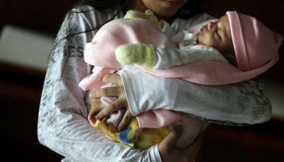 The 11-year old Paraguayan girl with her newborn.