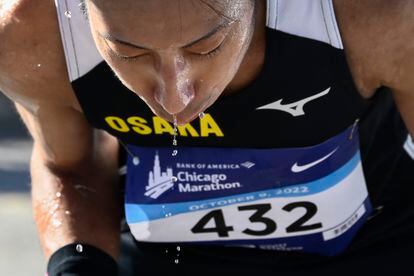 Hiroki Nakajimi cools off with water after completing the Chicago Marathon on Sunday October 9, 2022. 