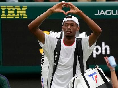 Christopher Eubanks of the US gestures to the crowd after losing to Russia's Daniil Medvedev in their men's singles match on day ten of the Wimbledon tennis championships in London, Wednesday, July 12, 2023.