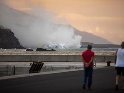 People in La Palma on Wednesday observing the column of smoke rising from the lava as it meets the sea.
