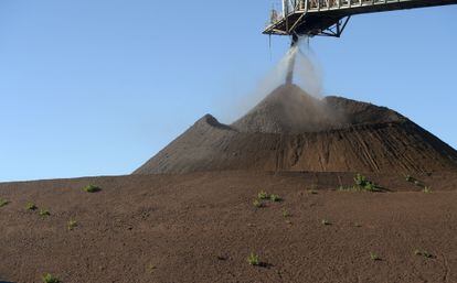 A crane transports iron powder at a mine in Australia in June this year.