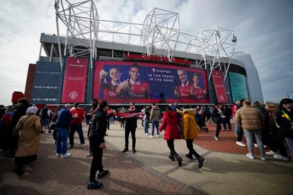Fans outside the Old Trafford stadium in Manchester ahead the English Premier League soccer match between Manchester United and Southampton, England, Sunday, March 12, 2023.