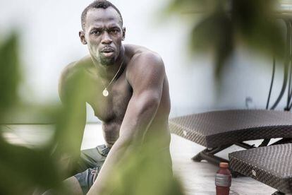 Usain Bolt at home after swimming training designed to help with a twisted ankle at the start of this year.