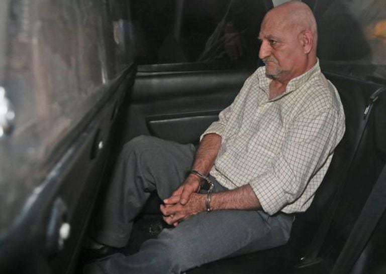 Galván in the police car which took him to a Madrid court after his arrest in Murcia.