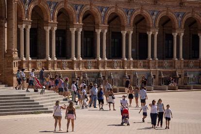 Tourists in Seville's Plaza de España on September 3.