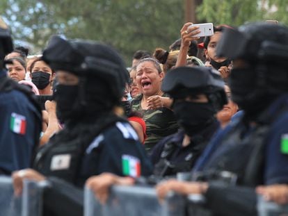 A relative of an inmate cries outside the prison in Ciudad Juárez where a riot broke out.