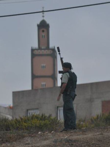 A Civil Guard patrols near the troubled El Príncipe neighborhood in Ceuta.