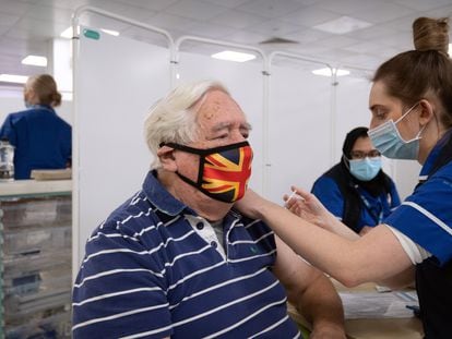 An elderly man receives the AstraZeneca-Oxford coronavirus vaccine in Stevenage, in the United Kingdom last month.