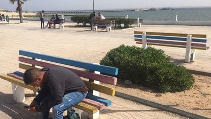 A young man on the seaside promenade in Dakhla.