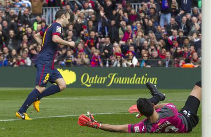 Andr&eacute;s Iniesta leaves Jordi Codina floored as he scores Bar&ccedil;a&#039;s fifth on Sunday.