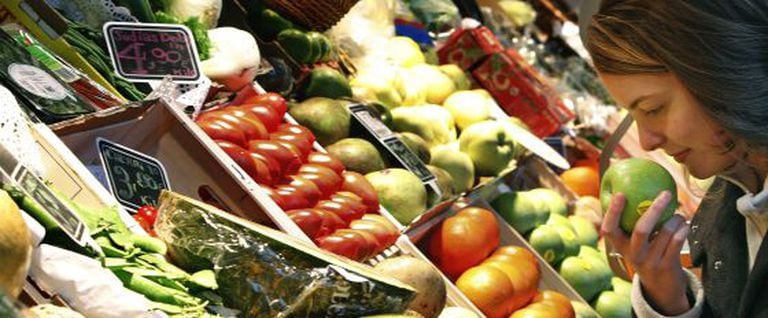 A woman at the San Miguel market in Madrid. Fruit will remain at the reduced 4 percent rate.