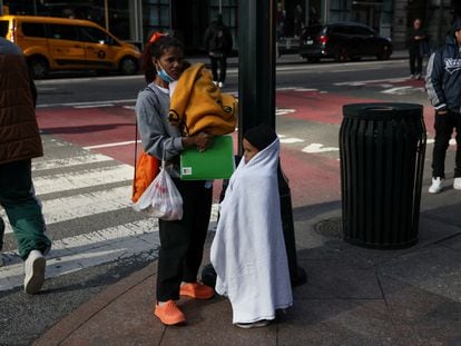 A Venezuelan migrant with her children in Midtown, New York, on January 8.