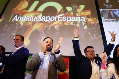 VOX party leader Santiago Abascal (center) and aides celebrate the election results.