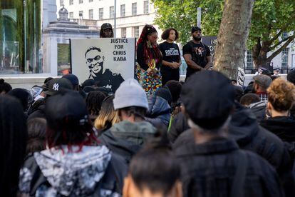 Black Lives Matter protesters observe one minute of silence in front of New Scotland Yard building in central London demanding justice for Chris Kaba.