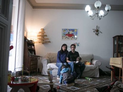 Mery and Gotzon with their two children in their home.