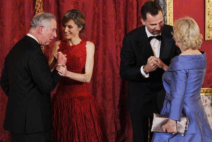 Prince Felipe and Princess Letizia greet Prince Charles and Camilla Parker-Bowles at the Royal Palace.
