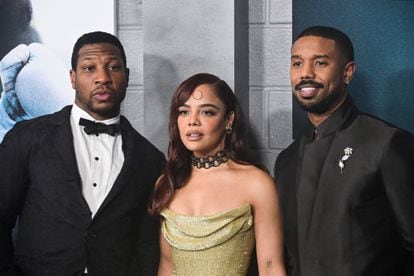 Actor Jonathan Majors, actress Tessa Thompson, and actor-director-producer Michael B. Jordan arrive for the Los Angeles premiere of 'Creed III' in Hollywood, California, on February 27.